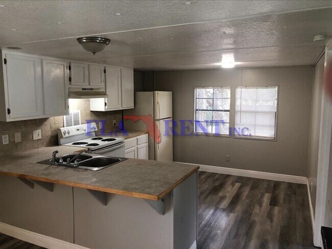 Building Photo - 3/2 Manufactured home with fenced in yard/ Bithlo area