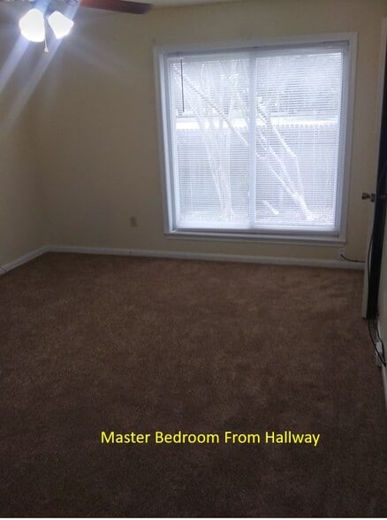 Master Bedroom from hallway. Master Bath is to the left. Master closet to the right - 7933 Bles Ave