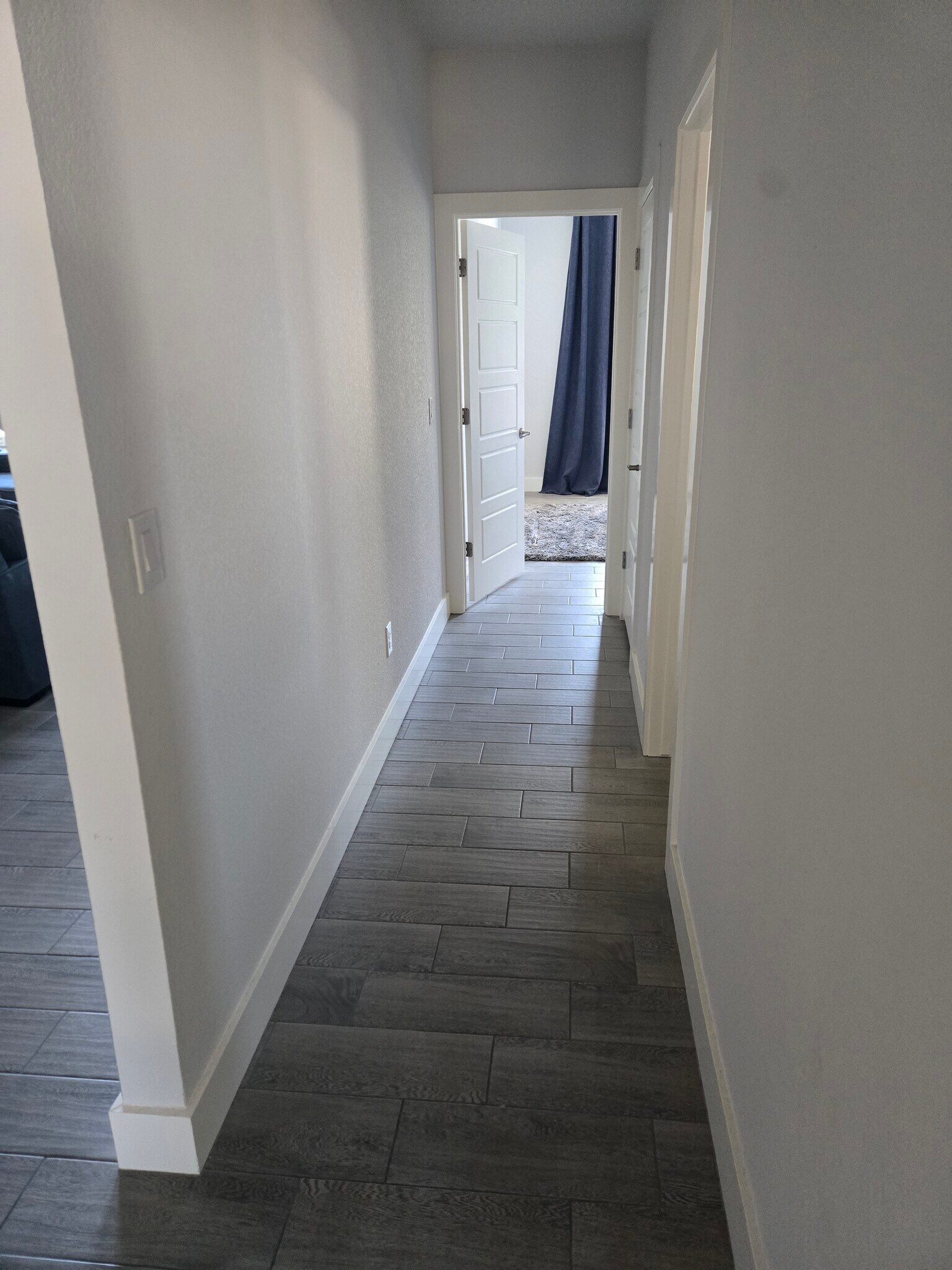 Long hallway separation between 2nd and 3rd room - 18605 Masters Cv