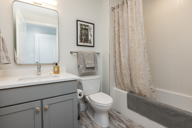 En-Suite Guest bathroom with deep soaking tub/shower. - 383 Commercial St