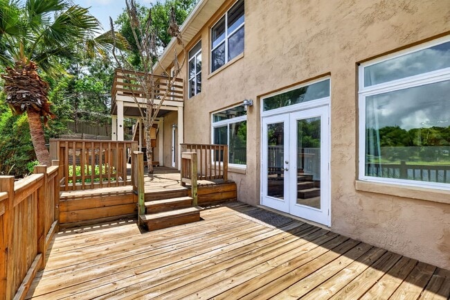 Building Photo - Available Now! Waterfront Living at Its Best – Pool, Decks & Gated Privacy