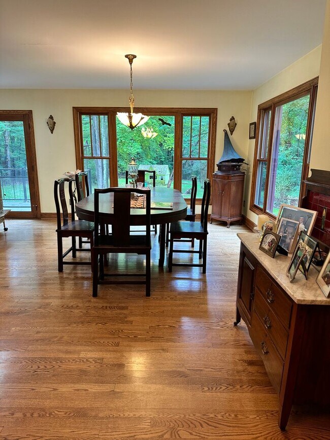 Building Photo - Dream Home in Highland, Michigan: Your Private Oasis on 5 Wooded Acres