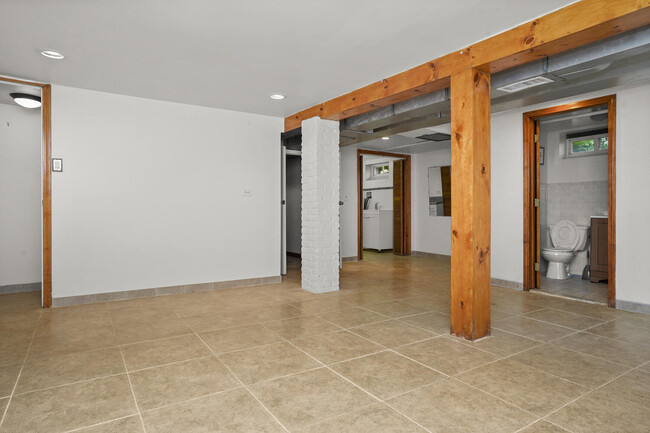 Finished basement with full bath and laundry. - 319 Davenport Ave