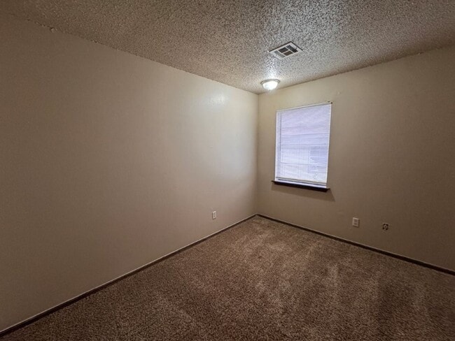 Building Photo - 2 bed duplex with 1 1/2 baths, bonus room and a 1 car garage for lease in SW OKC! (no fenced yard)
