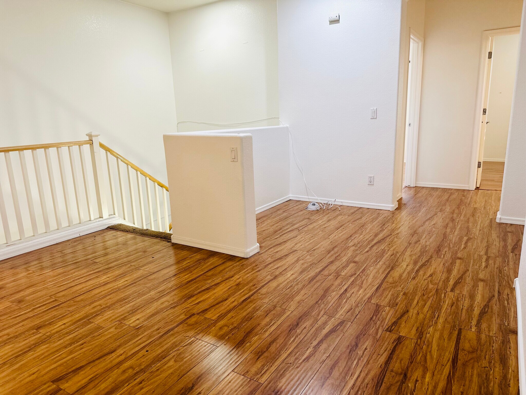 Spacious upstairs loft with wood-look flooring. - 1177 W Laredo Ave