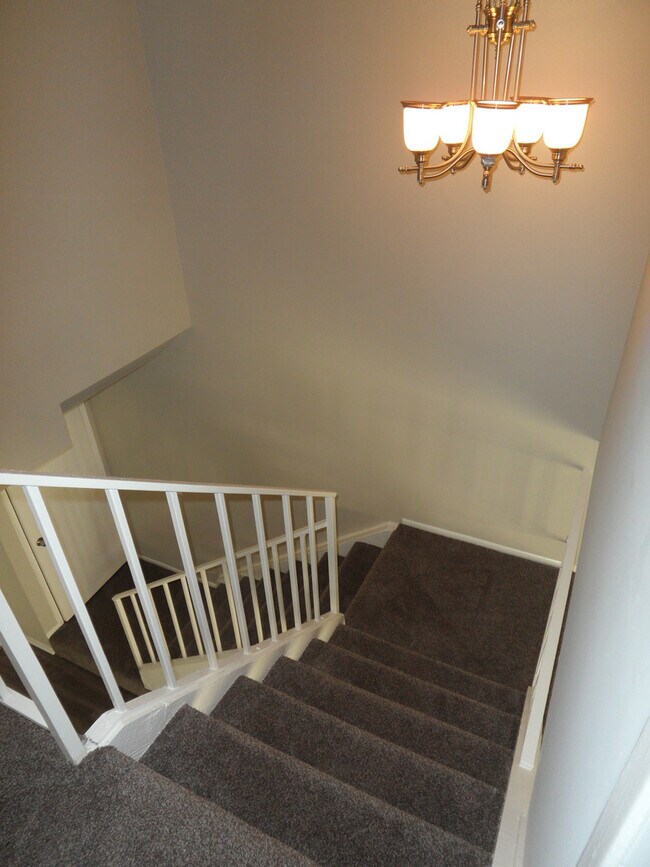 Building Photo - Two Story 4 BR 2.5 BA Condo With 2 Car Garage