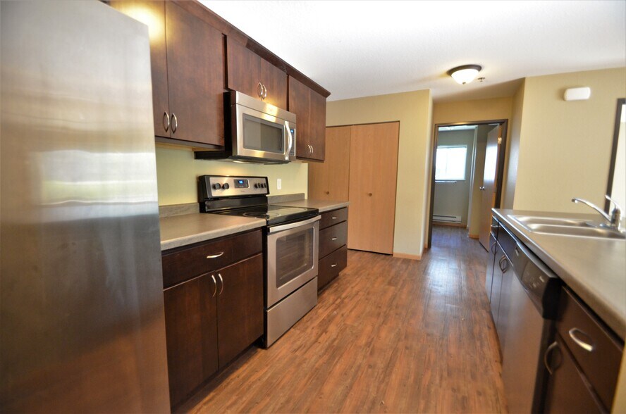 Kitchen w/ Stainless Steel Appliances - 420 11th St N