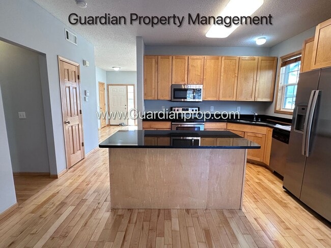 Building Photo - Hopkins Single Family Home, 2 Car Garage, Office, Gas Fireplace, Primary Suite