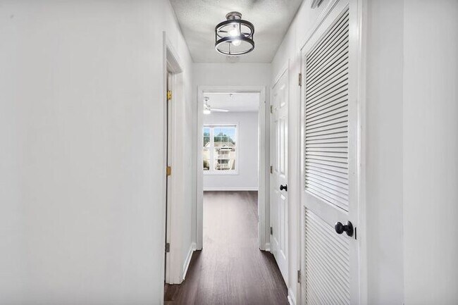 Building Photo - RENT SPECIAL! Freshly Painted! New Luxury Vinyl Plank Floors! Updated Lighting! Pool View Unit! C...