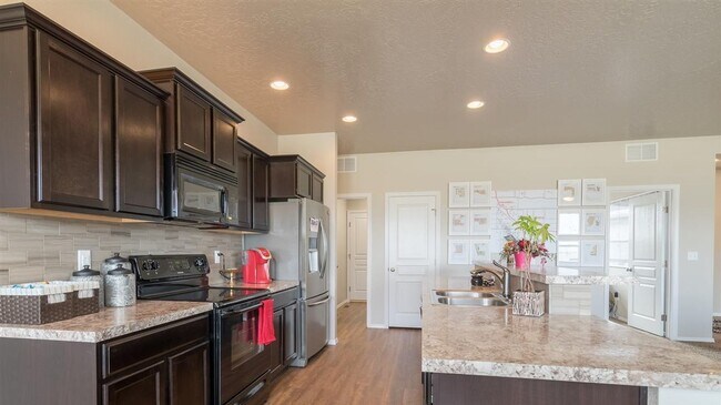 Building Photo - Coming soon! Great location 4 bedroom 2 ba...