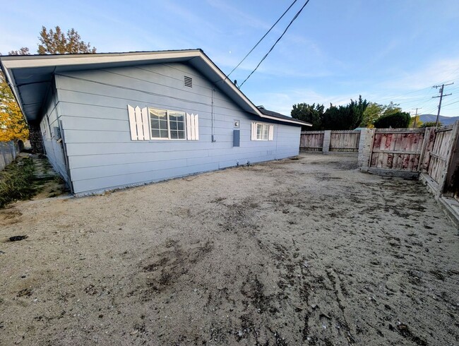 Building Photo - 4-bedroom house with a 2-car garage availa...