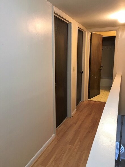 Second floor hallway leading to the bedrooms and second bath - 1900 Richard Jones Rd