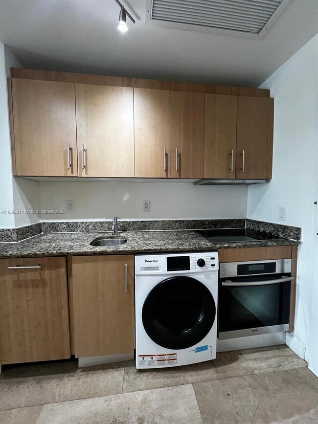 Building Photo - 10275 Collins Ave