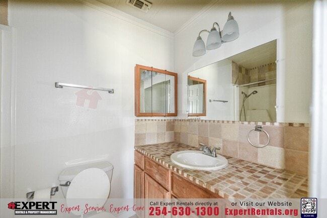 Building Photo - A cozy 3-bedroom, 2-bathroom home nestled on a corner lot