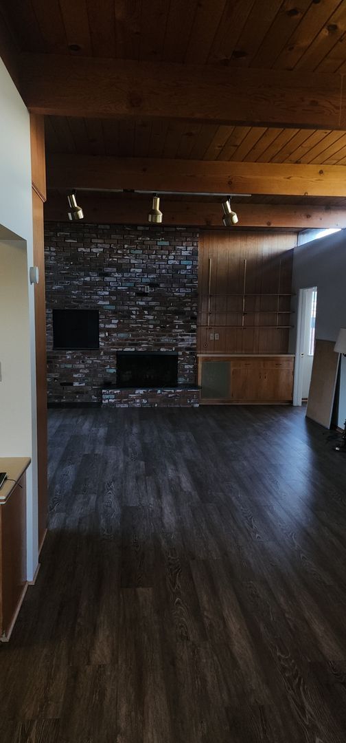 Building Photo - This is a spacious house featuring four bedrooms and two bathrooms, along with a two-car garage.