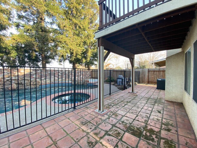 Building Photo - Spacious Home with a Pool & Hot Tub!