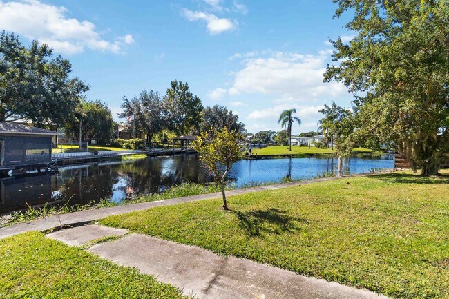 Building Photo - Charming 2BR/2BA Waterfront Home for Rent with Canal Access & Two Garages
