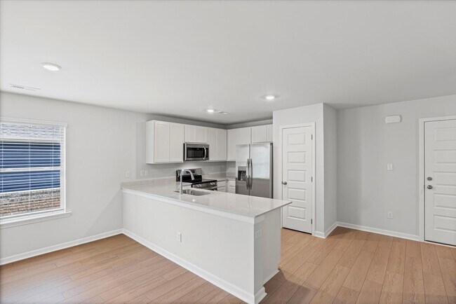 Building Photo - New 3BR Home in Whispering Woods – Modern ...