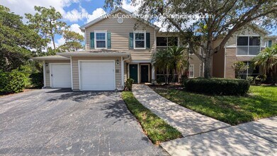 Building Photo - MOVE IN READY! LARGE 2 BEDROOM/2 BATH PLUS ATTACHED GARAGE! TILE/LVP THROUGHOUT!