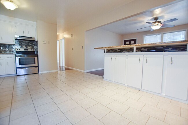 Building Photo - Three Bedroom with Fenced Yard!