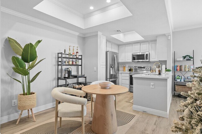 Building Photo - Remodeled River-View Corner Unit with Oversized Patio