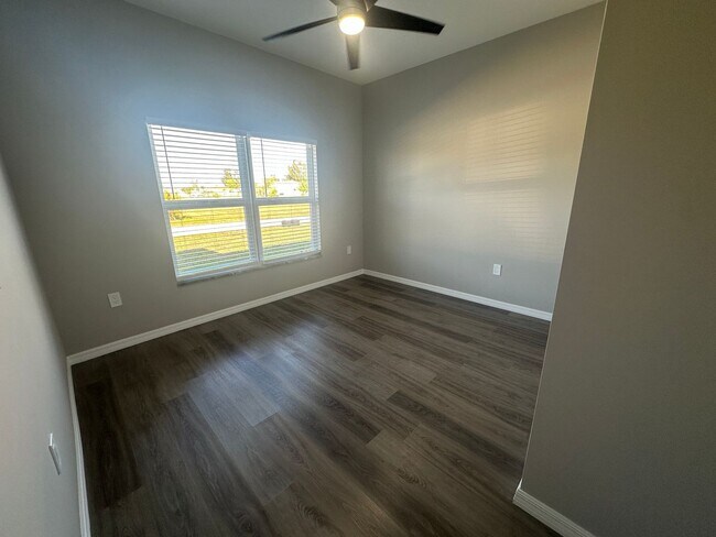 Building Photo - AVAILABLE MID APRIL- 4 Bedroom 2 bathroom 3 Car Garage NE Cape Coral Home with Screened Lania