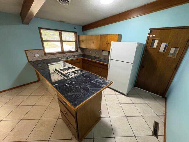 Building Photo - Spacious Home with Attached Garage & Fenced Backyard