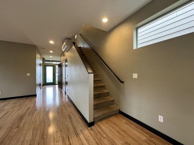 Building Photo - Charming 3 Bedroom, 2.5 Bathroom Home with Large Living Room, Tall Windows, Island Kitchen, and A...