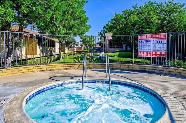 Building Photo - "Chic 1-Bed Retreat with Pool & Central Vacuum in Anaheim's Heart – 710 Sq Ft of Hardwood Elegance!"