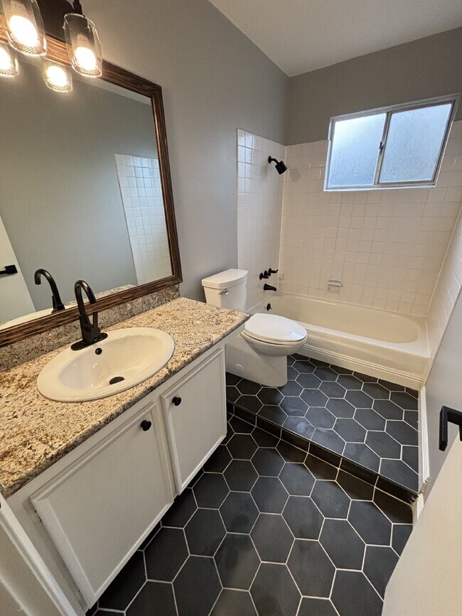 Building Photo - "Charming Concord Retreat: 3-Bedroom Gem with Granite Accents & Cozy Fireplace"