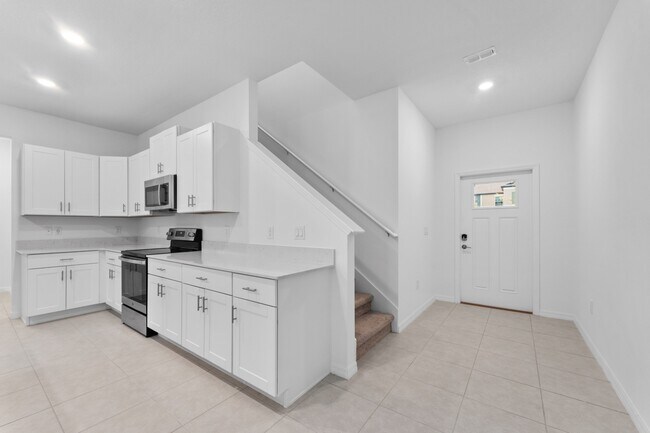 Building Photo - Absolutely stunning 3 BR /2.5 Bath / 2 Car Garage + LOFT townhome in ultra-modern and green-focus...