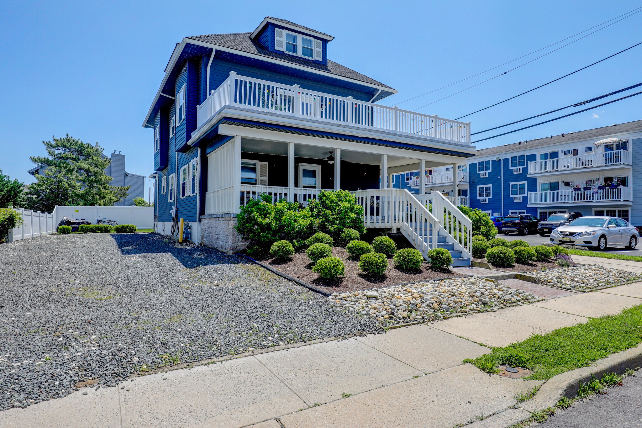 Newly landscaped front of house with parking for 3-4 cars per unit - 606 Beach Ave