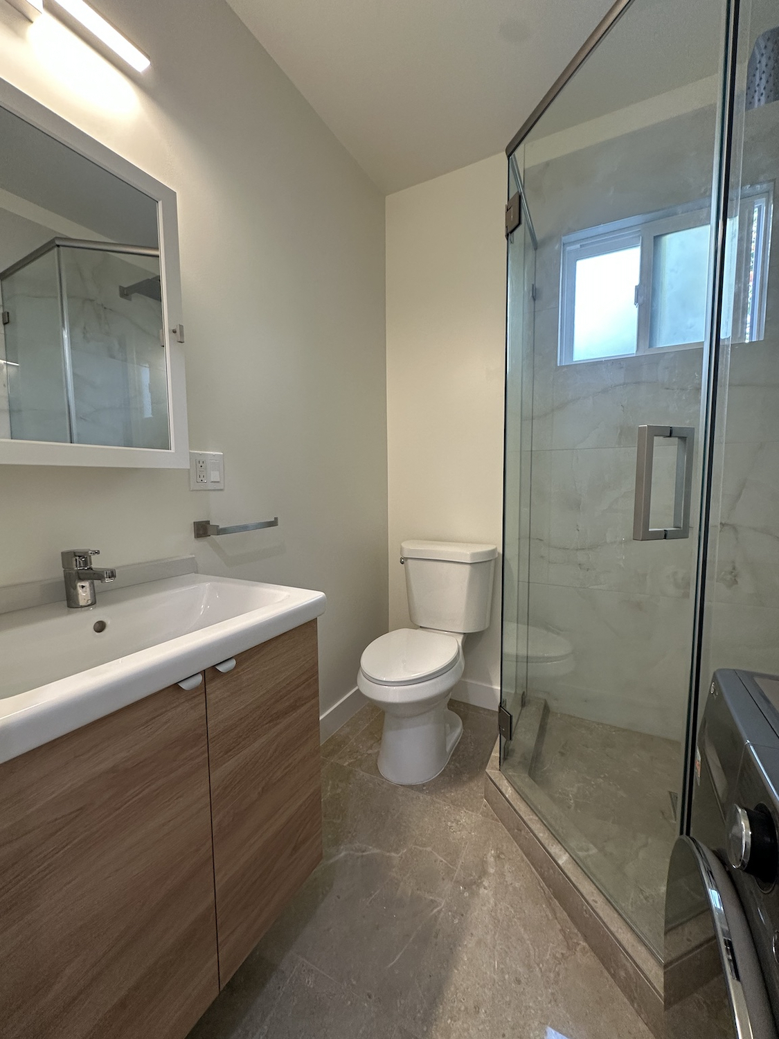 bathroom with electric washer and dryer combo - 10638 Tinker Ave