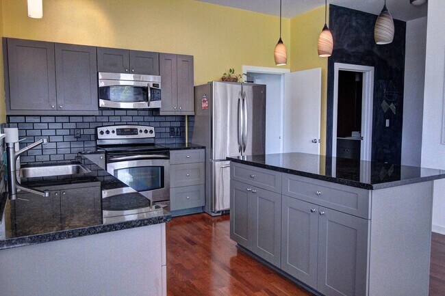 Building Photo - Downtown Durham 1bd/1ba Corner-Unit Condo with On-Site Personal 1-Car Garage!