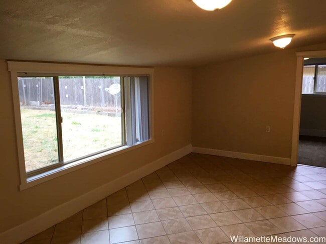 Building Photo - Spacious 4-Bedroom Home with Large Fenced Yard & Covered Patio