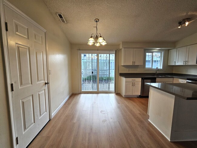 Building Photo - Charming Single-Level Home Featuring New Hardwood Floors, Bright Bedrooms & Open-Concept Living