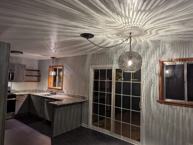 Festive accent lighting. - 2008 E Huntsville Rd