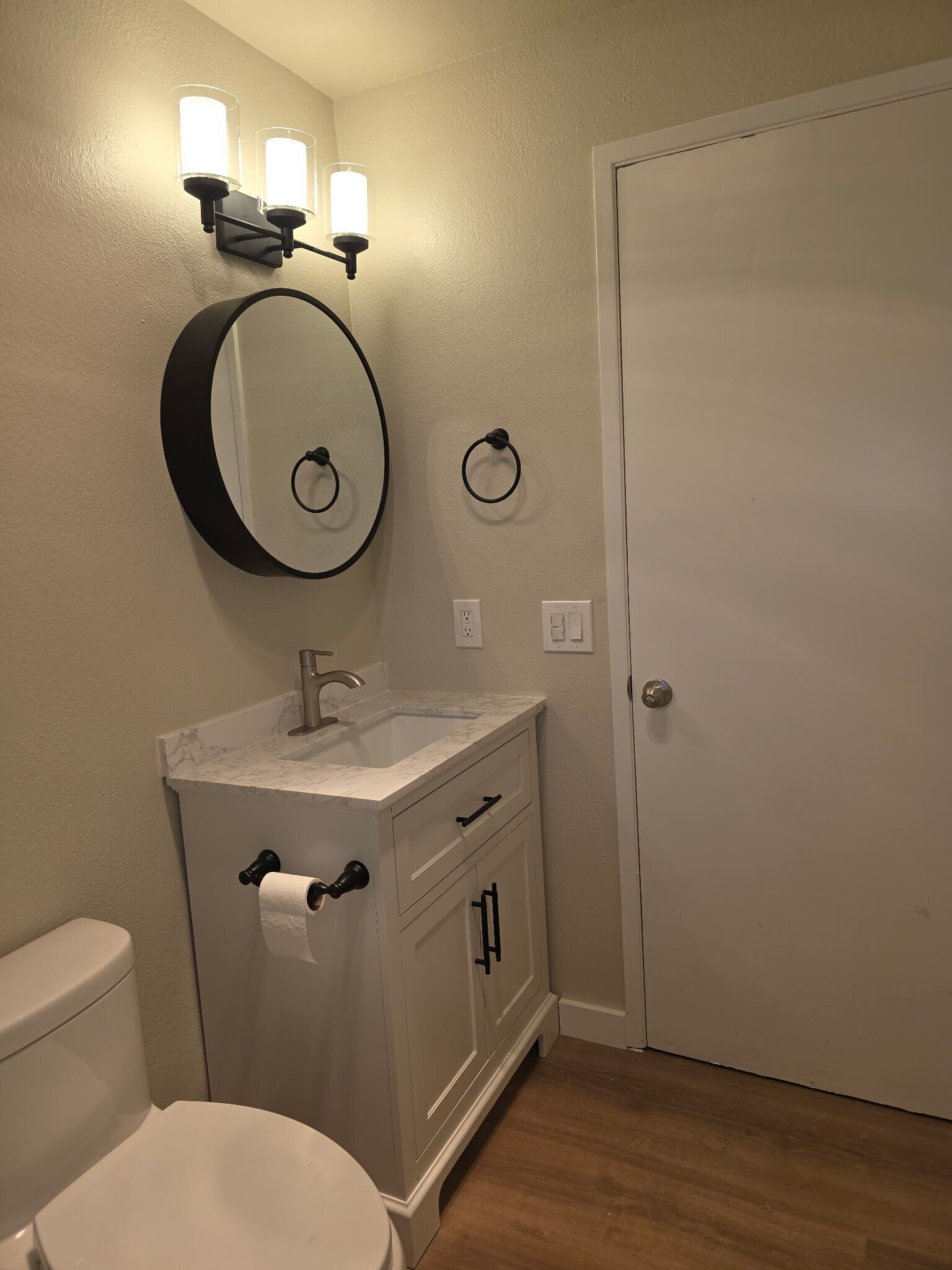 Bathroom vanity/toilet mirror opens as medicine cabinet - 7911 236th St SW