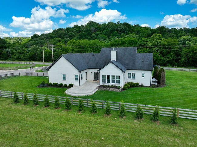 Building Photo - unning custom-built home on a full acre in...