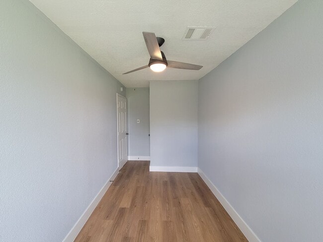 Building Photo - This beautifully updated 4-bedroom home is just under two miles from Highway 288 and Loop 610, ma...