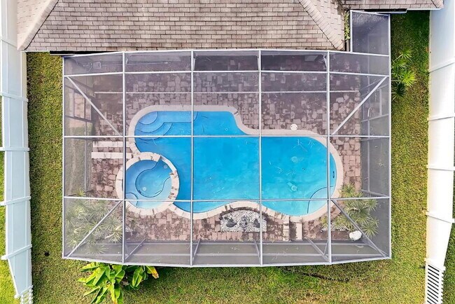 Building Photo - "Stunning 3BR Orlando Home with Private Screened Pool, Spa & Spacious Living Areas"