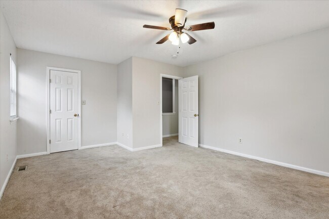 The home offers three spacious bedrooms! - 1644 Skiffes Creek Cir