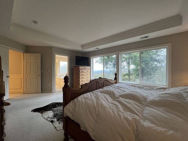 Building Photo - Executive-Style Northwest Heights Home with Forest Views and Refined Architectural Details