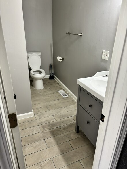 New flooring in bathroom - 2621 Arsenal St