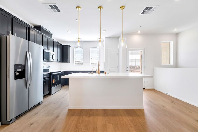 Building Photo - Modern Living in Cadence | Stylish Townhome with Open Concept & Community Amenities!