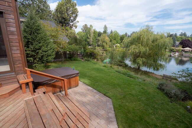 Building Photo - Private river access and stunning views from this home on Harmon Blvd! + Bonus Room