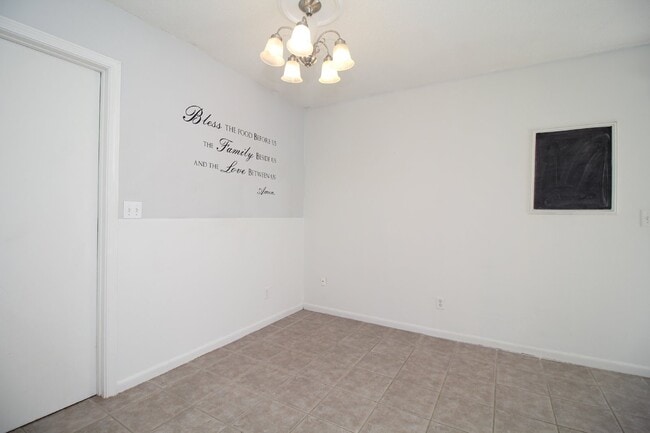 Building Photo - Spacious 3BR/1.5BA Home in Pace with Open Living Area, Tiled Family Room, and Fenced Backyard – M...