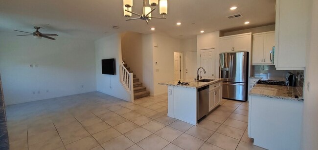 Building Photo - Beautiful townhome features a bright, open-concept layout