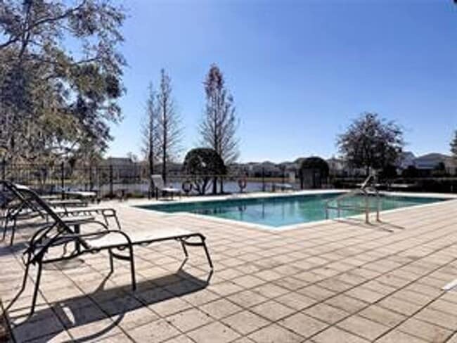 Building Photo - Water Front Home- 4 Large Bedrooms-3 baths Gated Community Call Sheila Campbell 407-687-7900