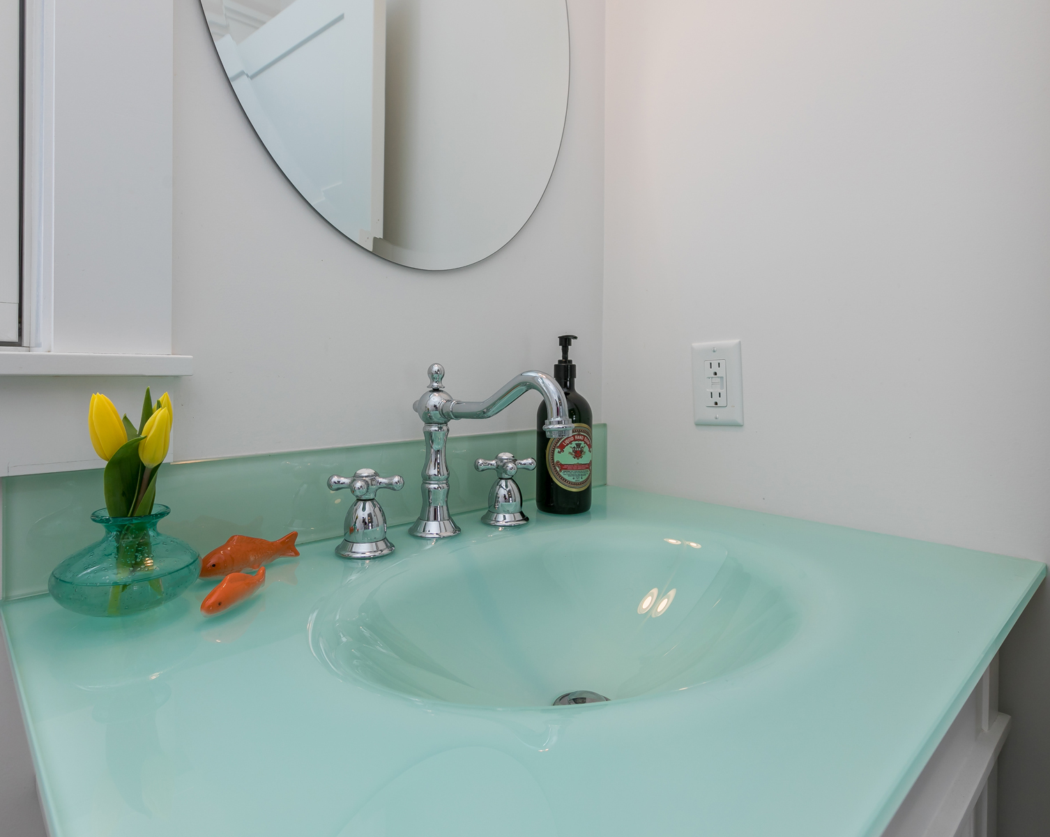 First floor powder room features a unique and beautiful glass sink. - 11 Henry St